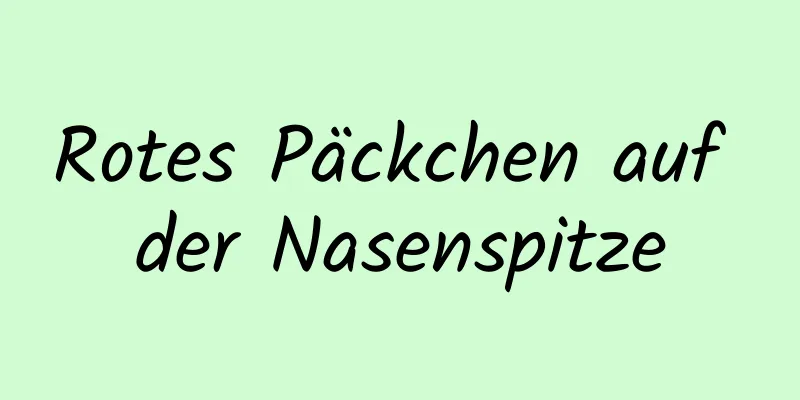 Rotes Päckchen auf der Nasenspitze